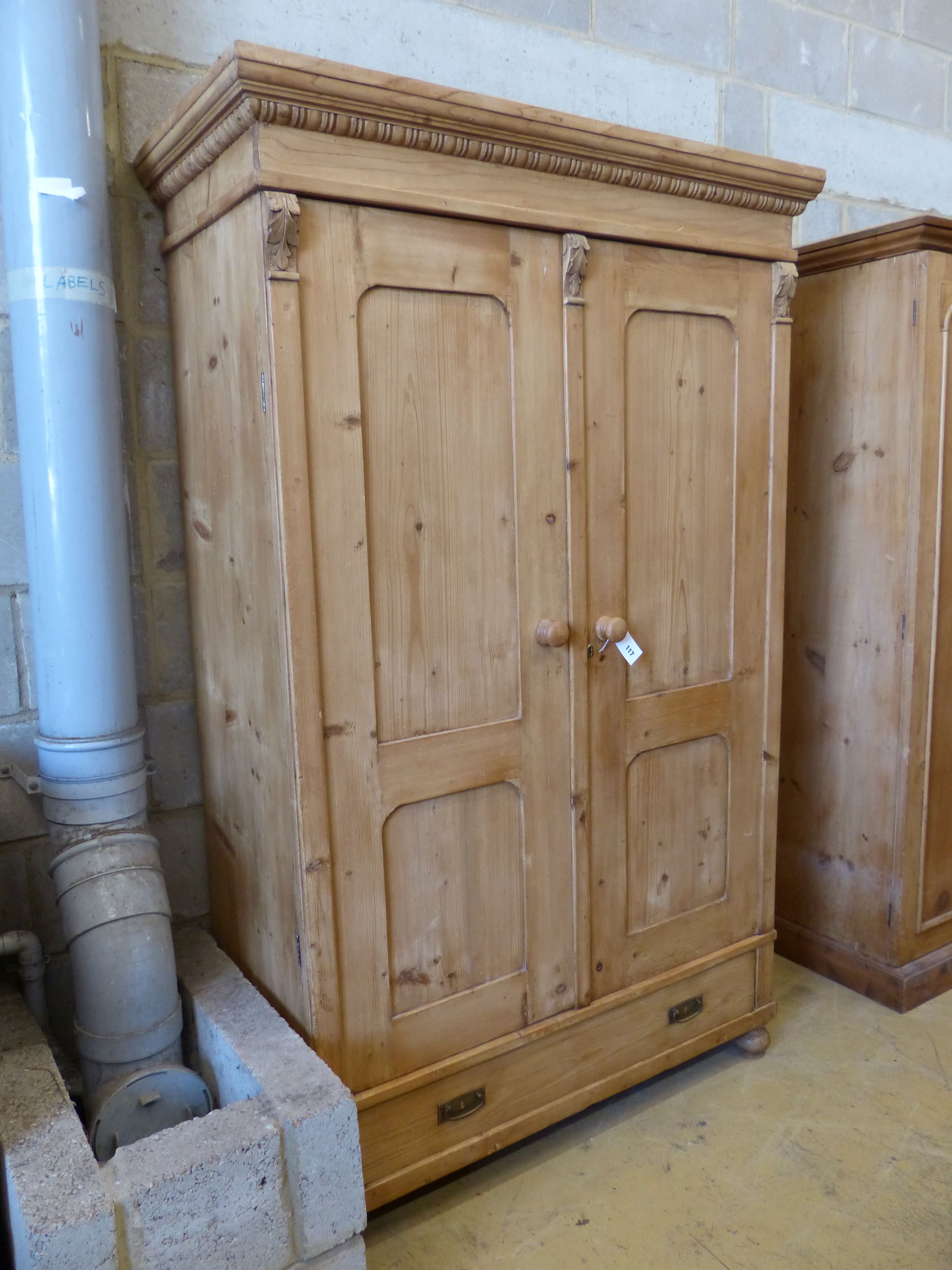 A 19th century East European pine two door wardrobe, length 118cm, depth 53cm, height 188cm